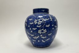 A large 19thc Chinese porcelain blue and white ginger jar with cover, decorated with flowering