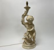 A tall moulded plaster table lamp in the Italian style featuring a cherub to the base with vines and