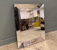 A contemporary Mid-Century style rectangular mirror with mirror surround and with bevelled mirror