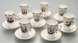 A 1960's Royal Worcester coffee set comprising eight coffee cups each with different flowers to