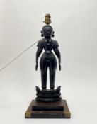 An Indian wooden carved Marapachi doll converted into a table lamp, raised on a stepped wooden