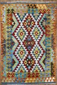 A modern hand-knotted Chobi kilim rug, central panel with repeating diamond motifs enclosed within a