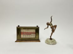 An oak and brass mounted perpetual desk calendar, the brass front with beaded border and stamped