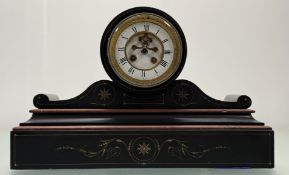 A Victorian slate mantle clock, with white enamelled roman numeral clock face with stepped red