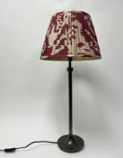 A Parex bronzed effect metal table lamp raised on a stepped round base, complete with a Pooky