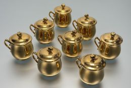 A set of eight Royal Worcester Gold Lustre chocolate pots with cover, marked verso. (h-9cm) (8)