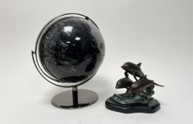 A bronze figure group of three swimming dolphins on a wave raised on a plaster base (h. 15cm),