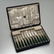 A 1920s epns set of six pairs of fruit knives and forks with early plastic jade green handles: