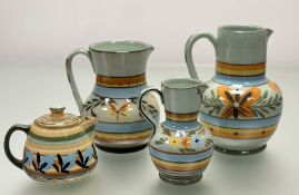 A collection of Mid-Century Hartrox Stoneware Jugs / Pitchers, Peasant pattern with floral