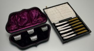 A cased set of six 1930s epns amberoid handled side knives: l. x 17cm together with a cased set of