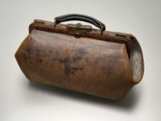 An Edwardian brown leather Galdstone style bag with cotton-lined interior and single interior