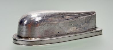 A19thc white metal snuff box of boat keel form with hinged top and gilt interior and engraved with