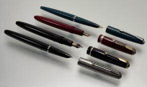 A collection of four vintage Parker fountain pens to include a black acetate 14k gold nibbed pen,