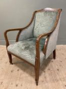 An Edwardian inlaid mahogany open armchair, inlaid patera to top with bross-banded arms, upholstered
