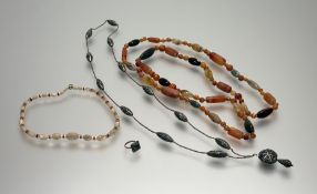 An exceptionally long polished hardstone necklace with green stone, carnelian, bloodstone, banded