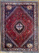 A hand-knotted South Persian Shiraz carpet, central hexagonal panel with medallion featuring all-