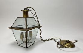 A brass and bevelled glass hanging porch lantern (h. lantern 35cm)