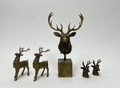 A resin Stag bust raised on a square base with bronzed effect (h.3cm), together with a pair of resin