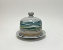 A Highland Stoneware cheese dome decorated with a seascape on a grey glazed ground (marked verso) (