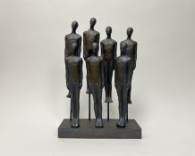 A contemporary figure group consisting of seven standing resin figures with painted bronze effect,
