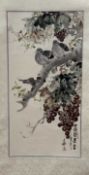 A 20thc Chinese School silk scroll depicting perched on a grape tree, watercolour on paper, with red