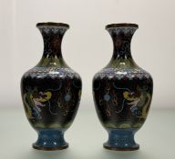 A pair of 20thc Chinese Cloissonne vases, with imperial dragon chasing the burning pearl. (h-