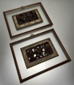 A pair of hand carved Chinese relief panels of birds and flowers, presented within glazed gilt and