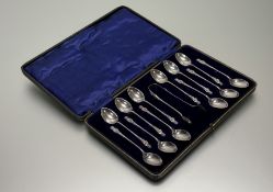 A George V Sheffield silver set of twelve apostle spoons and matching tongs: spoon l. x 11cm in