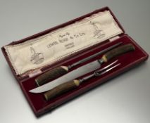 A Lewis Rose & Co Ltd of Sheffield stainless steel stag horn handled three-piece carving set: