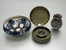 A collection of Studio Pottery comprising, a green glazed small plate with brown edging (marked