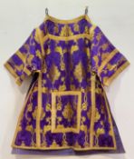 A Spanish Rich Woven purple motif textile with gilt thread Brocaded Dalmatic in a Rica Design. (