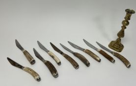 A set of nine Sheffield Cutlery Shop steak knives with stainless steel mirror polished serrated