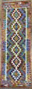 A modern hand-knotted Chobi kilim runner, central panel with row of repeating diamond motifs