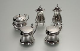 A Birmingham composite five-piece condiment set comprising a pair of pepperettes: h. x 8.5cm