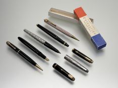 A group of pens including a Parker black cased pen with 14k gold nib with propelling pencil together