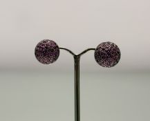 A pair of 9ct white gold circualr bombe stud earrings set pink faceted cut stones in miligrain