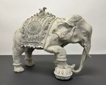 A decorative stone-carved Indian elephant with (h. 37cm x w. 44cm)