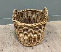 A large twin-handled woven wooden log/kindling basket (h. 50cm)