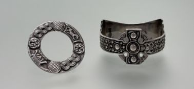 A Robert Allison Glasgow silver Celtic circular brooch with knot, mythical beast and longboat design