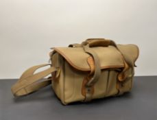 A Billingham tan canvas and leather camera bag, with fitted interior (l. 40cm x h. 26cm)
