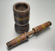 A 19thc possibly Indian, large hand-carved wooden hand-painted mortar (h- 29cm) and pestle (l-55cm).