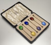 An Edwardian Birmingham set of six silver gilt seal handled tea spoons with guilloche enamel backs