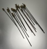 A collection of fifteen Turkish skewers with cast brass handles in the form of dogs, birds, ships