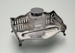 An Edwardian Sheffield silver deskstandish with gallery back and original cut crystal ink bottle