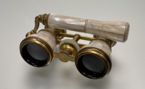 A Ladies Mother of Pearl Opera glasses, with adjustable handle.