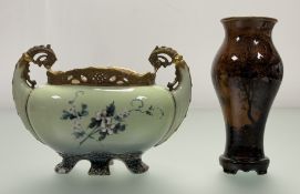 An Austrian Ernst Wahliss twin handled posy bowl in a green glaze with floral display to front
