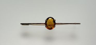 A 9ct gold bar brooch set oval faceted citrine approximately 3ct: l. x 6cm 3.87g