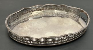 A Sheffield plated gallery tray with raised pierced edge with additions of wreath border, raised