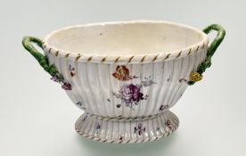 An Early 19th century English Creamware footed ribbed basket, with hand-painted floral sprays with
