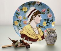 A collection of decorative wares comprising, a wooden childrens hand-painted folk art paddle with